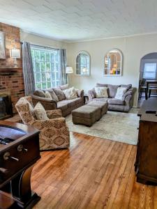 a living room with couches and a table at Hook Wine and Sinker in Marion