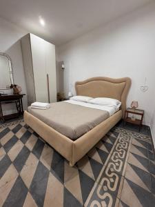 a bedroom with a large bed in a room at La Corte del Castello in Bari