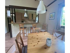 a dining room with a wooden table and chairs at Ferienhaus mit Garten, Eschede in Eschede