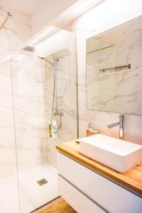 a bathroom with a sink and a shower at Villa Martena in Cambados +22 photos