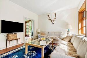 a living room with a couch and a tv at LF11977-Struer-Norskovvej-17 in Vemb