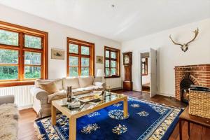 a living room with a couch and a table at LF11977-Struer-Norskovvej-17 in Vemb