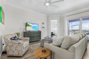 a living room with a couch and a tv at Lavender Life in Saint James City