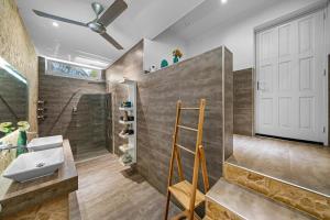 a bathroom with a sink and a shower and a toilet at Bamboo Bonaire by Boutique Bonaire Unique Resorts in Kralendijk +43 photos