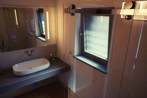a bathroom with a sink and a window at Aurora Lucana in Matera +17 photos