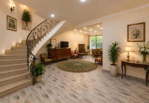 a lobby with a staircase and a living room at Dream House Hostel & Hotel in Yerevan