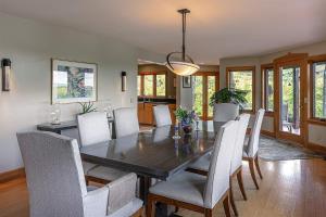 a dining room with a wooden table and chairs at Valley View in Stowe