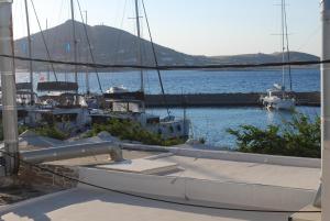 a boat docked at a marina with boats in the water at Busho Residence 1 in Naousa
