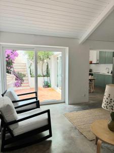 a living room with a couch and a chair and a table at Casa d´Abela in Abela