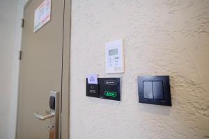 a room with a door with a electronic device on the wall at The Rizon Hotel in Antalya