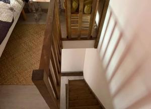 a stairway in a room with a stair case at Maison atypique et confortable in Mamers