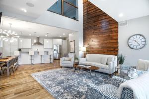 a living room with a kitchen and a dining room at Lakefront Luxury in Mound