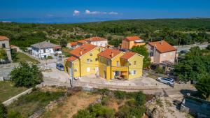 an aerial view of a large yellow house at Casa delle Rondini in Belej