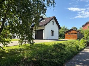 a white house with a black roof at Gîte La Borbotte in Malmedy