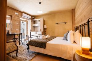 a bedroom with a bed and a desk in a room at La Contrà Valpolicella in Fumane +152 photos