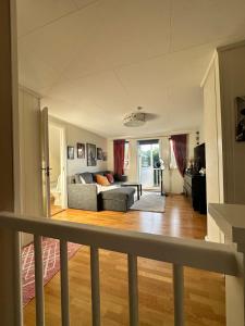 a living room with a couch and a table at Enebolig i Larkollen in Moss +27 photos
