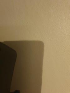 a shadow of the corner of a white wall at Femöre marin in Oxelösund