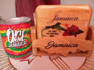 a can of tamarapa next to a wooden sign at Movement and Reposé in Clarks Town