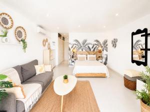 a living room with a couch and a table at Studio ALIZEA in Saint Martin +14 photos