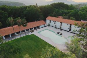 an aerial view of a house with a swimming pool at Hotel Hacienda Concá in Conca