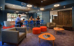 a group of people sitting at a table in a room at Novapark in Santiago +40 photos