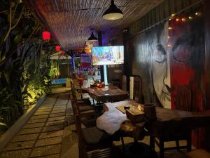 a dining room with a table and chairs in a restaurant at Lotus Haven Villa in Siem Reap