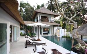 a villa with a swimming pool and a house at Burapha hotel in Ban Ta Sang