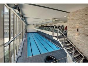 a large swimming pool in a large building at The Quadrant Apartment A406 in Cape Town