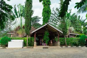 a house with a bunch of trees around it at Destination Resort Centre in Gikuu