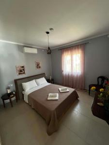 a bedroom with a large bed and a window at Villa Harmony in Xanthi +80 photos