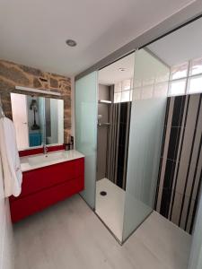 a bathroom with a sink and a mirror at Mar De Pedra in Cangas de Morrazo +28 photos