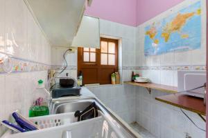 a kitchen with a sink and a counter top at Casa del Sol in Bogotá +36 photos