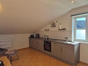 a kitchen with a sink and a stove at Monteurswohnung Bredstedt in Bredstedt