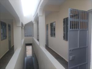 an empty hallway with a door in a building at Mtomo vision in Mtwapa