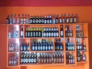 a shelf filled with lots of soda bottles at Mtomo vision in Mtwapa