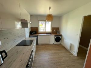 a kitchen with a sink and a counter top at La Guignicourtoise in Guignicourt +14 photos
