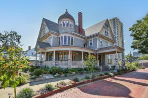 a large house with a turret on top of it at 1895 Victorian Home on Historic Walnut Street in Springfield