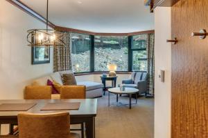 a living room with a couch and a table at Community Perks! Everline Resort & Spa Retreat in Olympic Valley