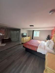 a hotel room with a bed and a desk at Chaplin Inn & Suites in Chaplin