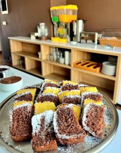 a cake on a plate on a table at Valmar Hotel in Ksamil
