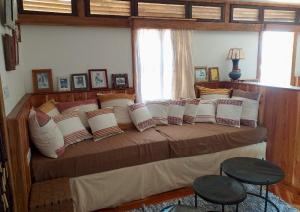 a bedroom with a large bed with pillows at Rimbud guest house in Hārer