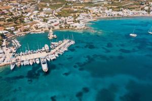 an aerial view of a marina with boats in the water at Araucaria Beachfront Residence in Finikas +6 photos