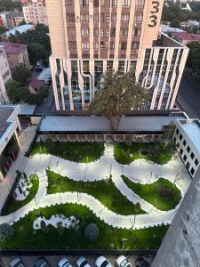 an aerial view of a garden in front of a building at Абдрахманова 176 in Bishkek