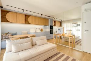 a living room with a couch and a table at Matosinhos in Matosinhos