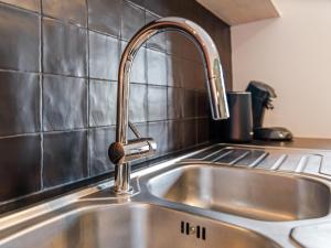 a kitchen sink with a faucet on top of it at Rozenberghoeve in Ploegsteert +61 photos