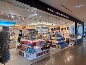 a grocery store aisle with a large amount of products at Prince Plage OKINAWA 6F in Fuzuchi