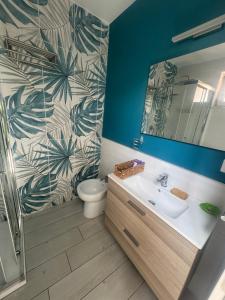 a bathroom with a toilet and a sink and a mirror at Casa Vacanze Aurelia in Procida +46 photos