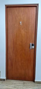 a close up of a wooden door in a building at Dormitorio matrimonial 01 in Lima +6 photos