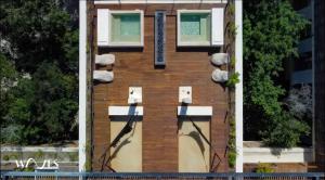 a building with lights on the side of it at Amelia By Waves in Tulum