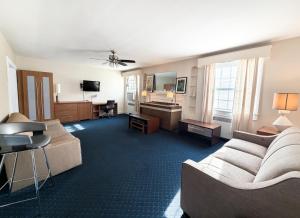 a living room with a couch and a table at Majestic Hotel & Apartments in Ocean City